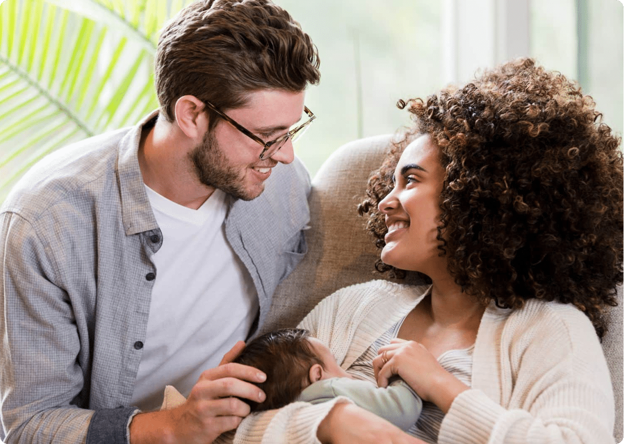 Family with mum breastfeeding